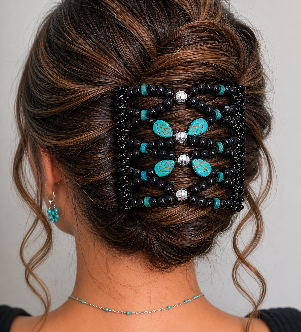 Close-up of Turquoise Leaf & Black Wood  Stainless Steel Hair Gripper Comb in a styled Up do. 